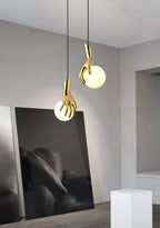 Avnorira Hand Holding Globe Brass Glass Pendant Light