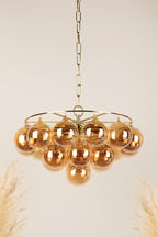 Aurora Chandelier Clear Glass Globe Aged Brass Elegant