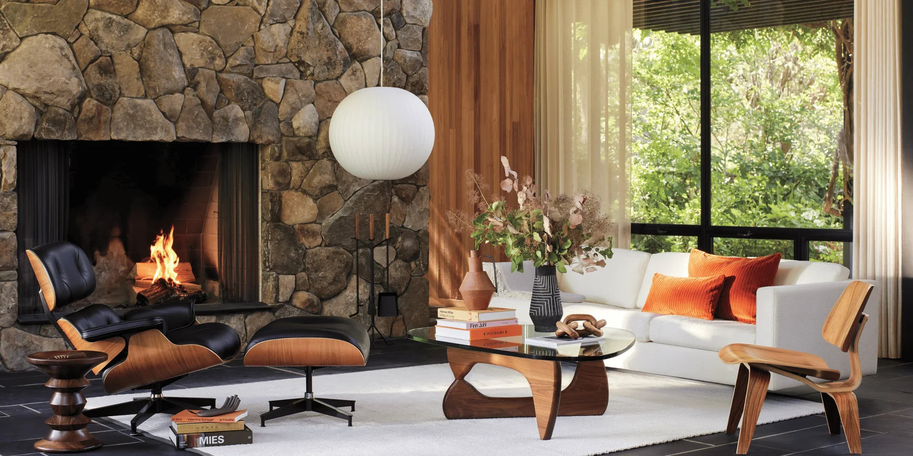 Warm modern living room illuminated by a sculptural floor lamp